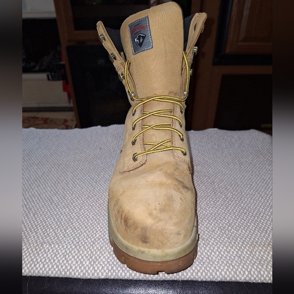 A pair of Herman Survivors leather boots in a men's size 11.5 Wide. Safety Toe. - Picture 8 of 12